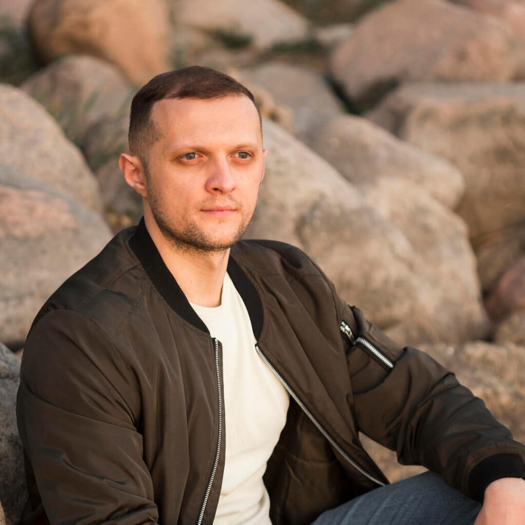 man sitting on rocks