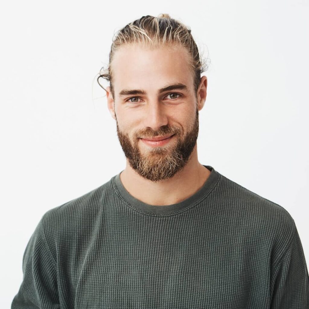 portrait beautiful mature blonde bearded guy with trendy hairdo